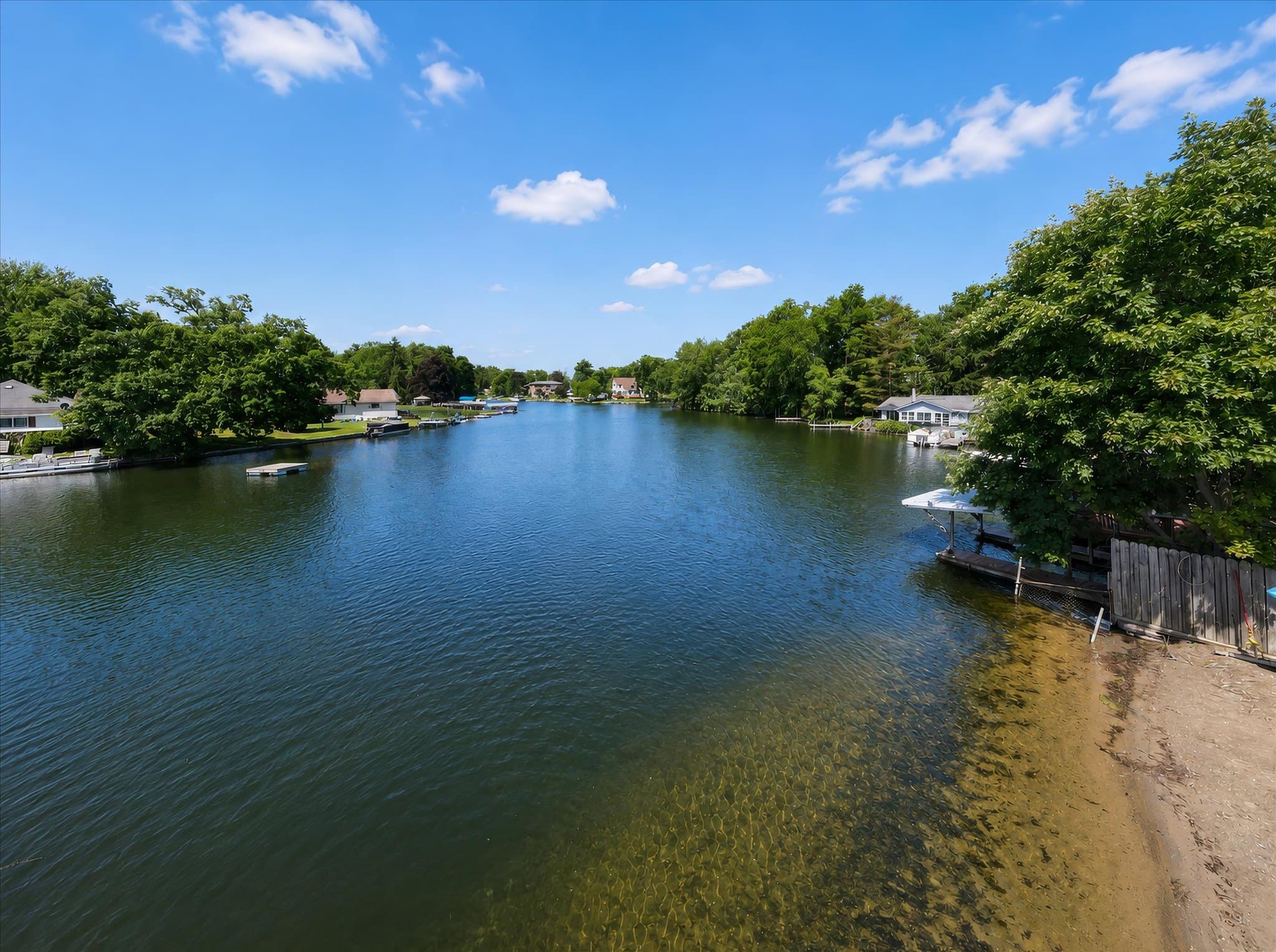 Lakefront setting and covered deck at Olde Mill Inn of Clarkston