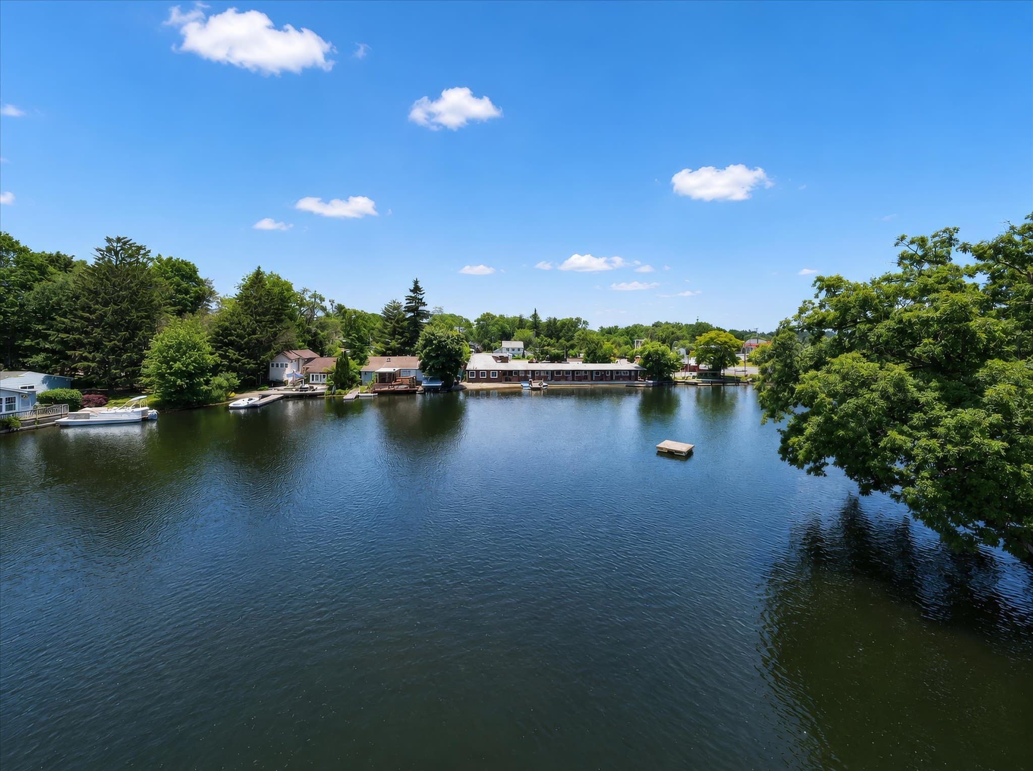Lakefront setting and covered deck at Olde Mill Inn of Clarkston