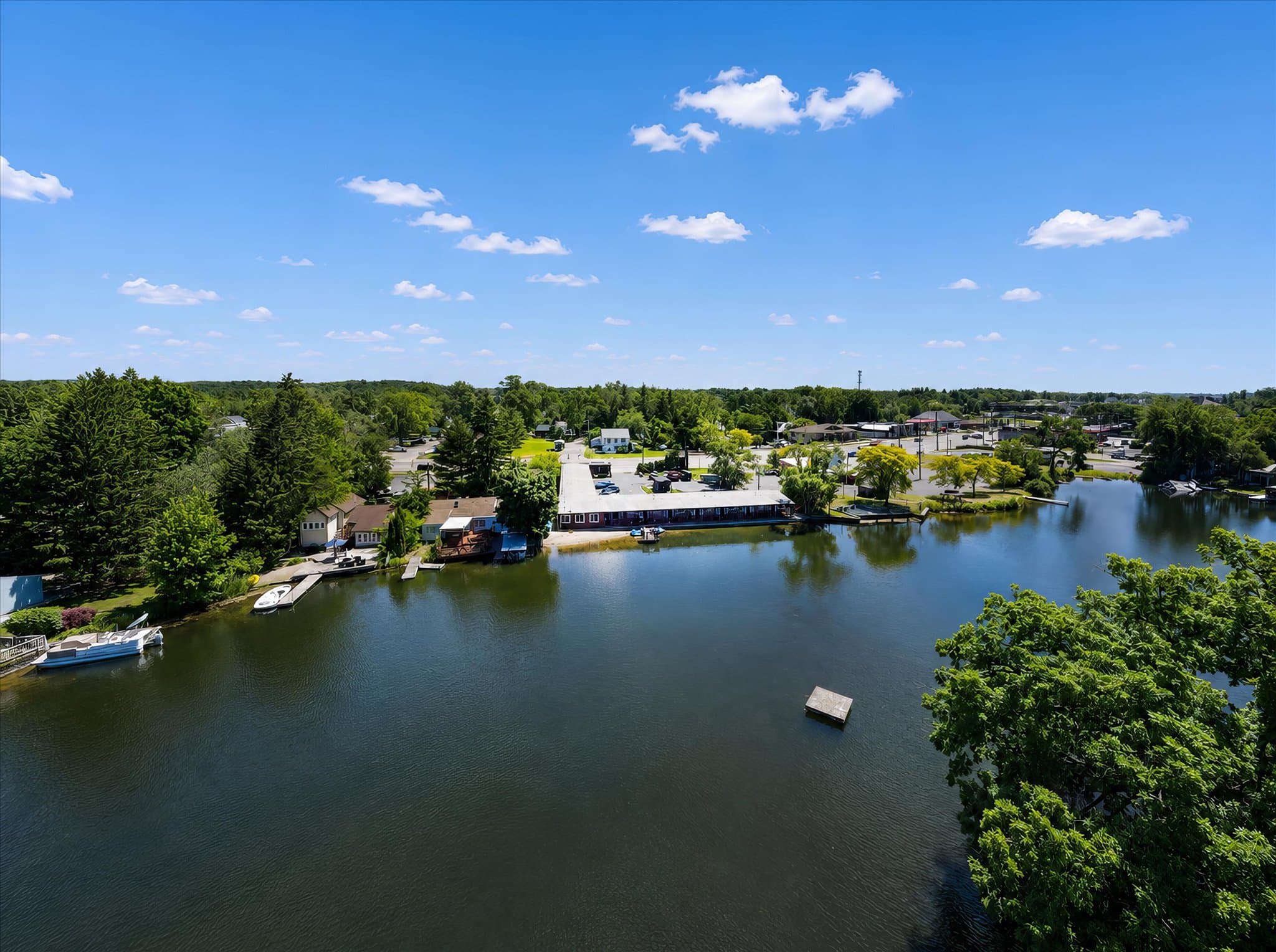 Lakefront setting and covered deck at Olde Mill Inn of Clarkston