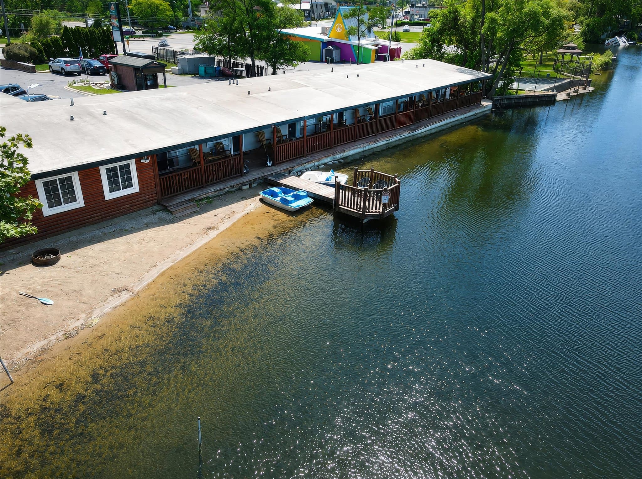 Lakefront setting and covered deck at Olde Mill Inn of Clarkston