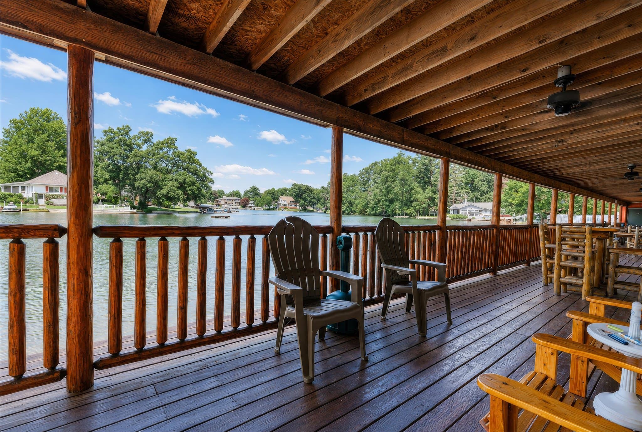 Lakefront setting and covered deck at Olde Mill Inn of Clarkston