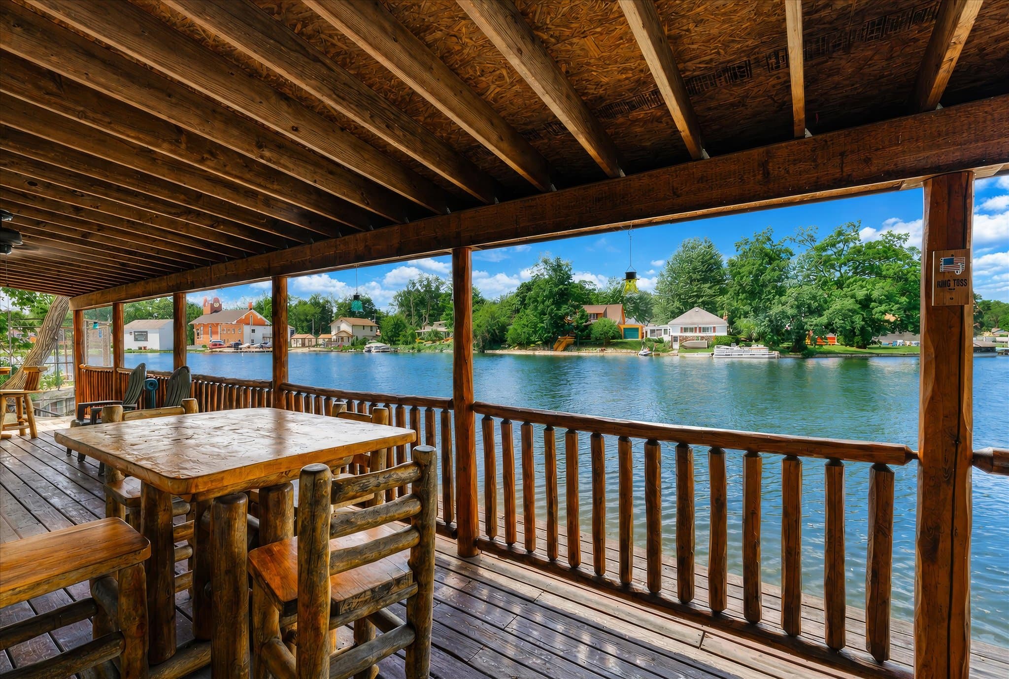 Lakefront setting and covered deck at Olde Mill Inn of Clarkston