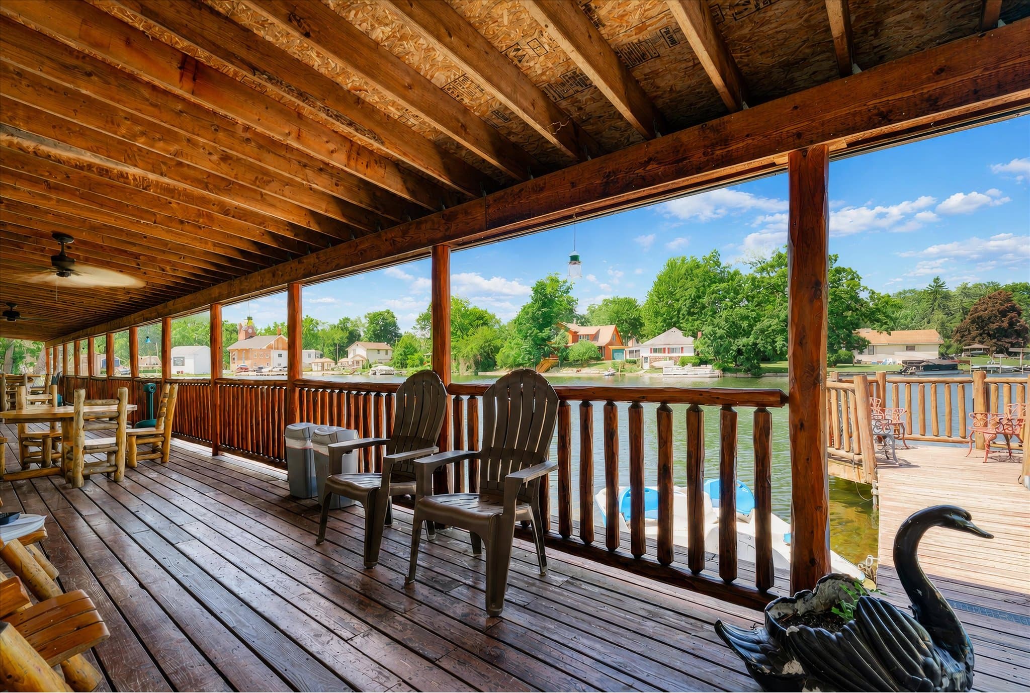 Lakefront setting and covered deck at Olde Mill Inn of Clarkston