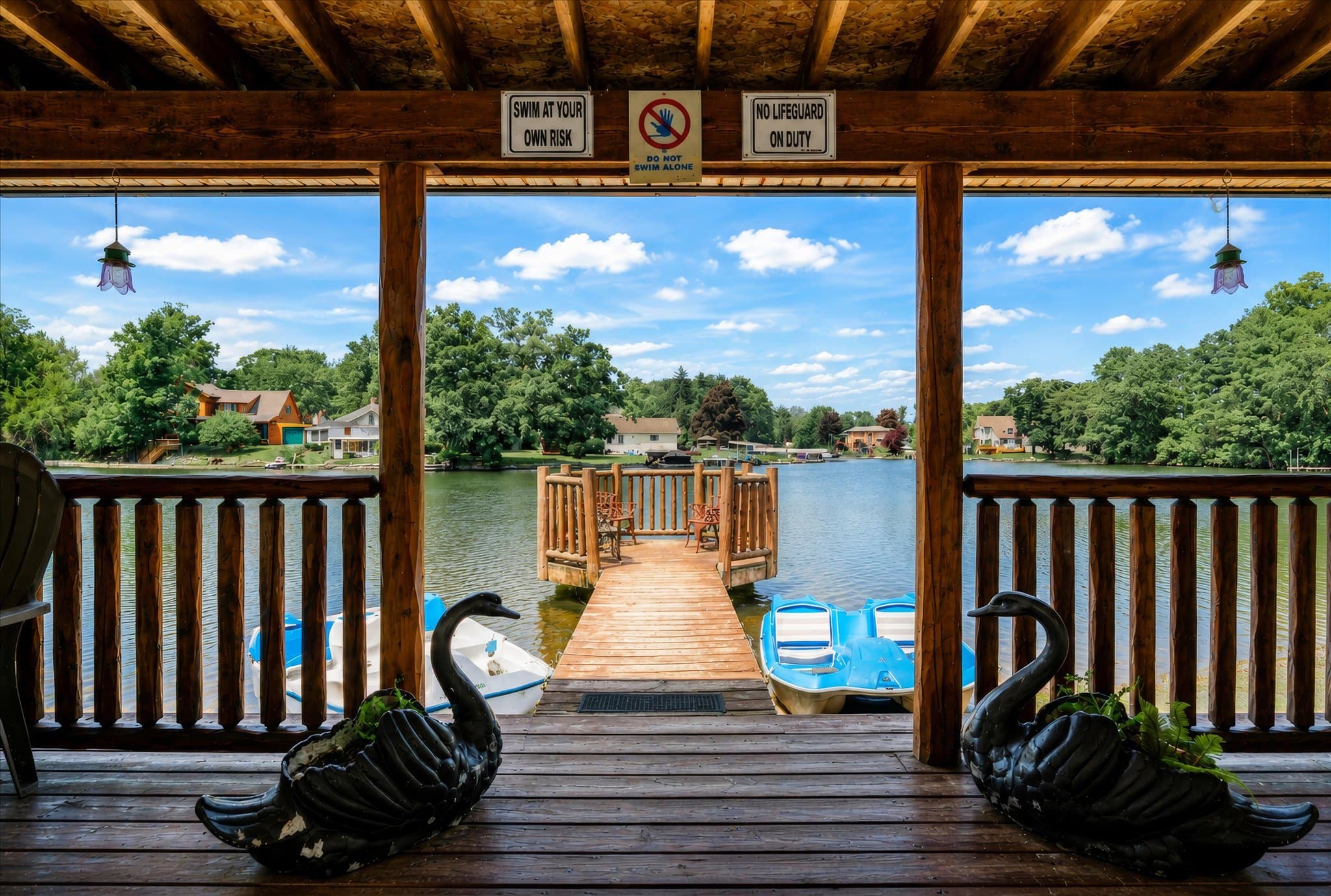 Lakefront setting and covered deck at Olde Mill Inn of Clarkston
