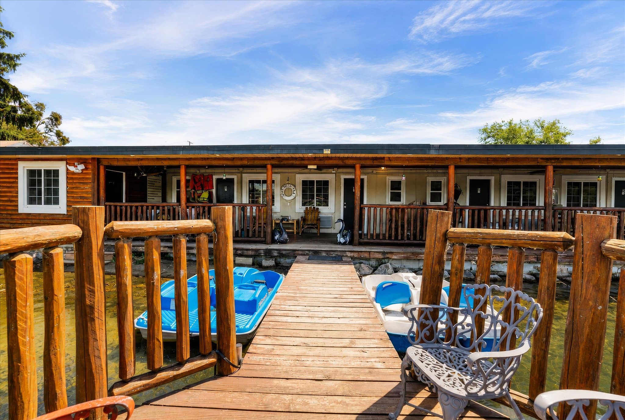 Lakefront setting and covered deck at Olde Mill Inn of Clarkston