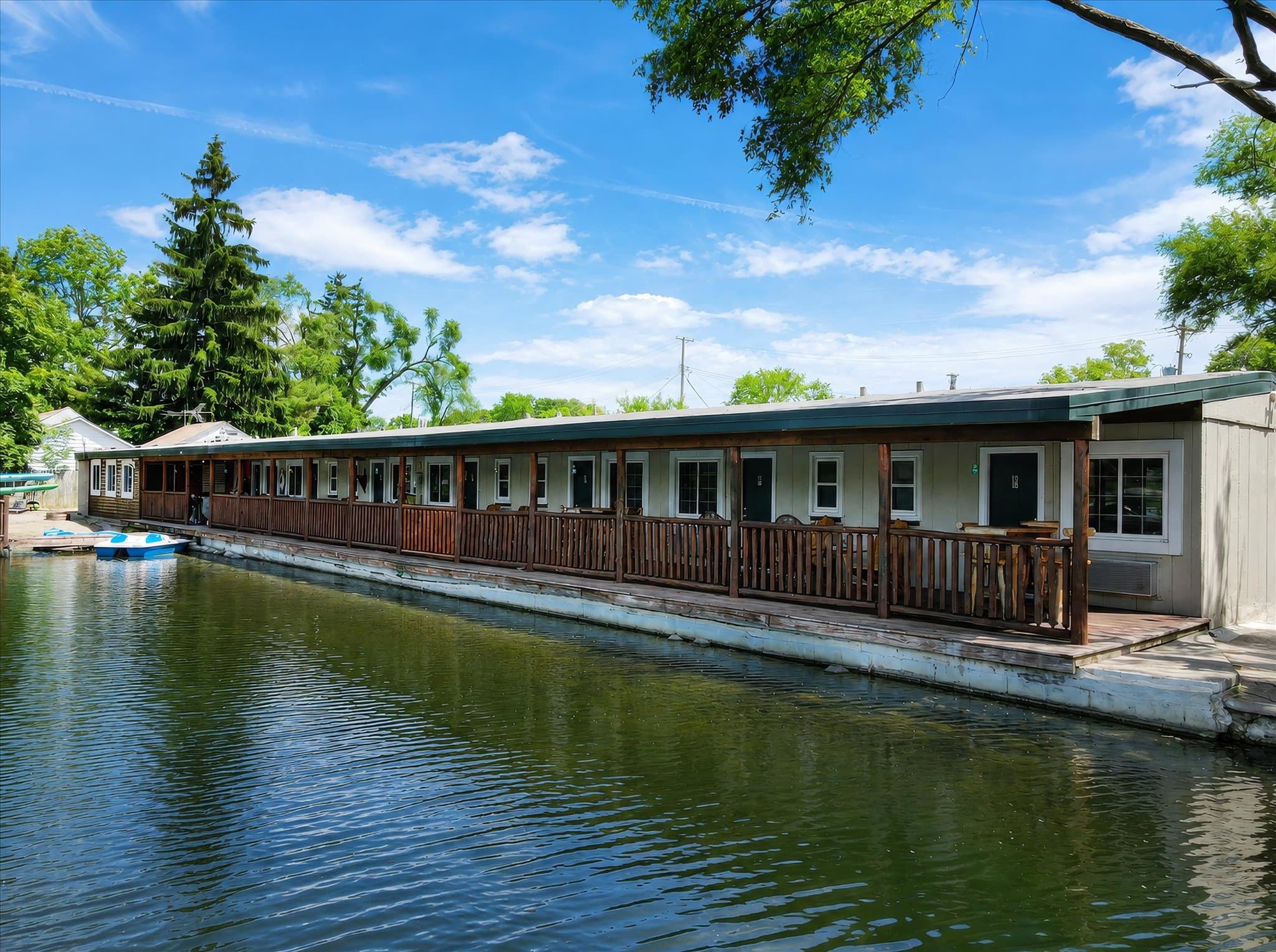 Lakefront room building over the water at Olde Mill Inn of Clarkston
